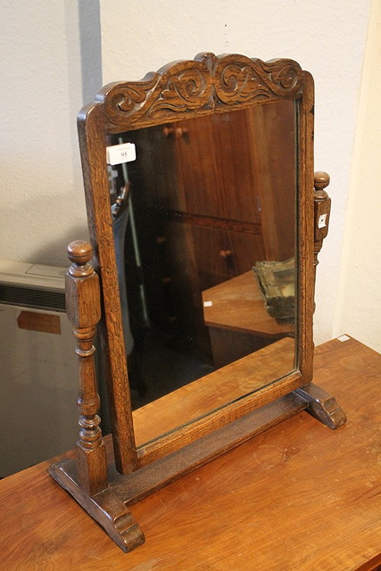 Appraisal: A REPRODUCTION OAK SWING TOILET MIRROR