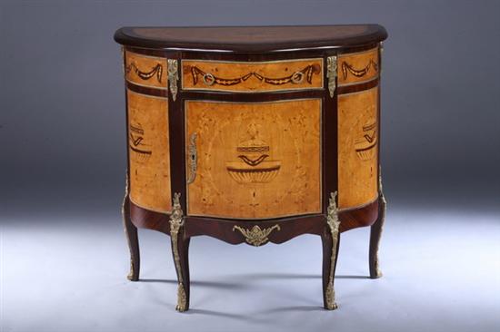 Appraisal: LOUIS XV STYLE MARQUETRY-INLAID MIXED-WOOD PETITE COMMODE th century with