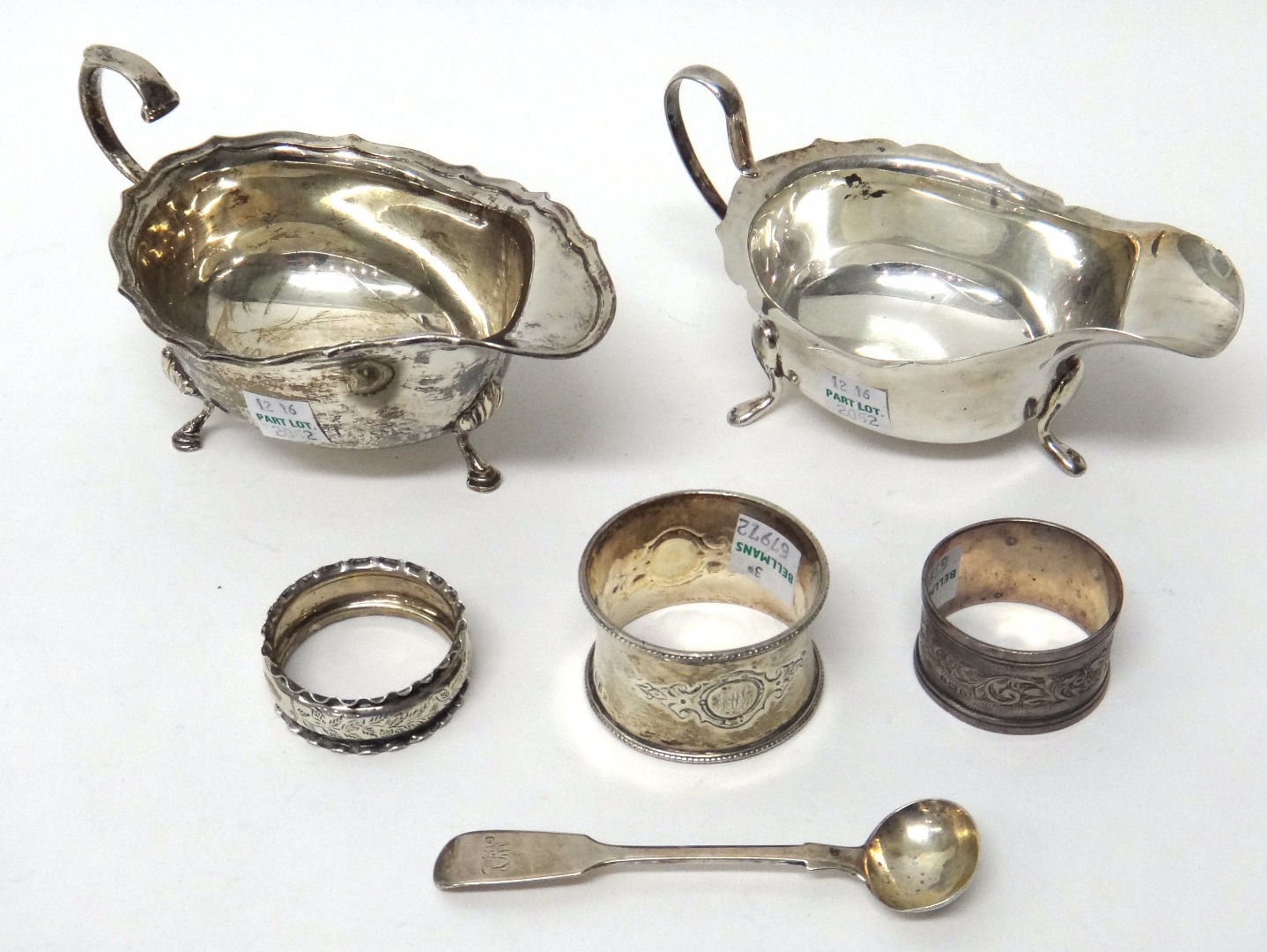 Appraisal: Silver comprising a sauceboat with a shaped rim scrolling handle