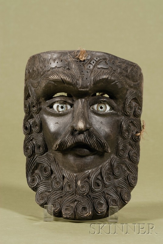 Appraisal: Carved and Ebonized Wood Mask with Glass Eyes th century