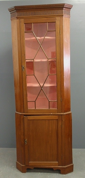 Appraisal: - English two-part mahogany corner cupboard c with Greek key