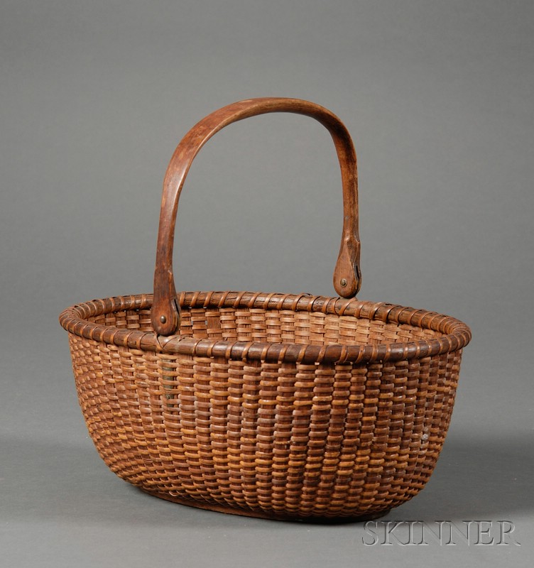 Appraisal: Oval Nantucket Basket America early th century with carved swing