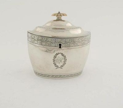 Appraisal: A George III bright-engraved oval tea caddy with a stepped