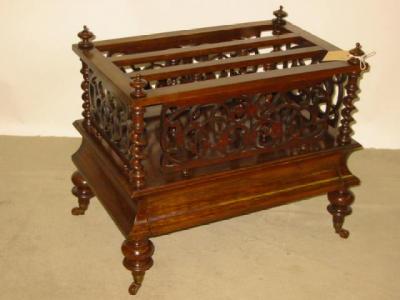 Appraisal: A VICTORIAN WALNUT CANTERBURY of oblong form with turned finials