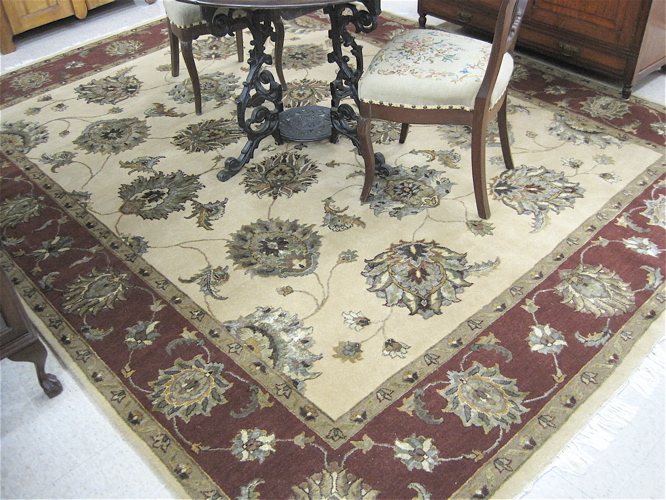 Appraisal: HAND KNOTTED ORIENTAL WOOL AND SILK CARPET overall floral design