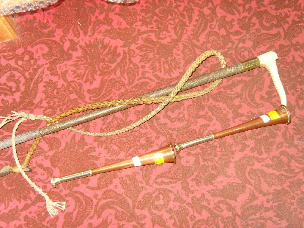 Appraisal: A leather riding crop with carved bone handle together with