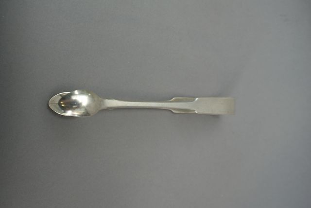 Appraisal: A pair of fiddle pattern sterling silver sugar tongs by