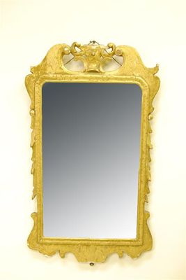 Appraisal: A giltwood wall mirror in George I style x in