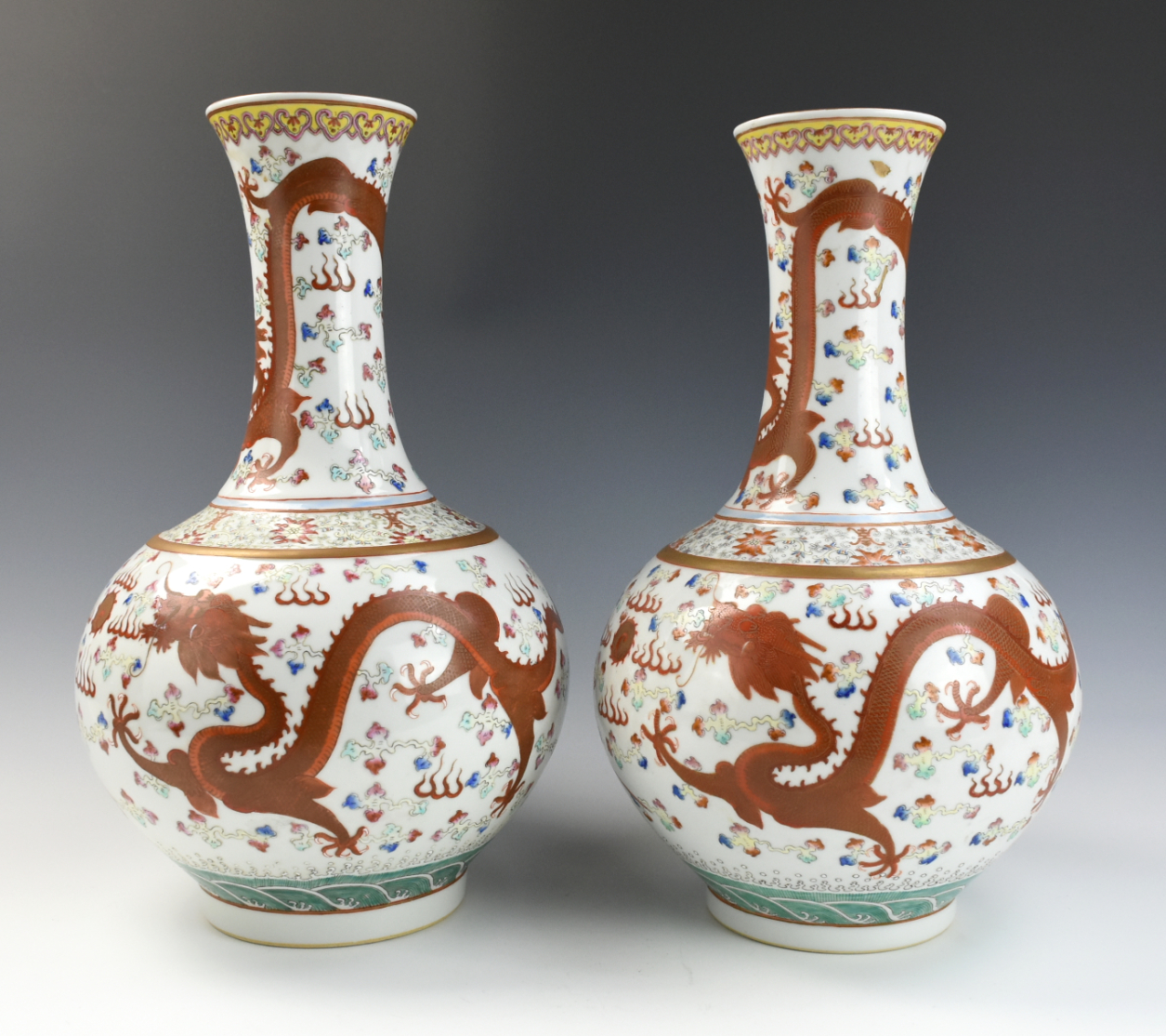 Appraisal: PAIR OF FAMILLE-ROSE 'DRAGON' BOTTLE VASE GUANGXU two Chinese Gungxu