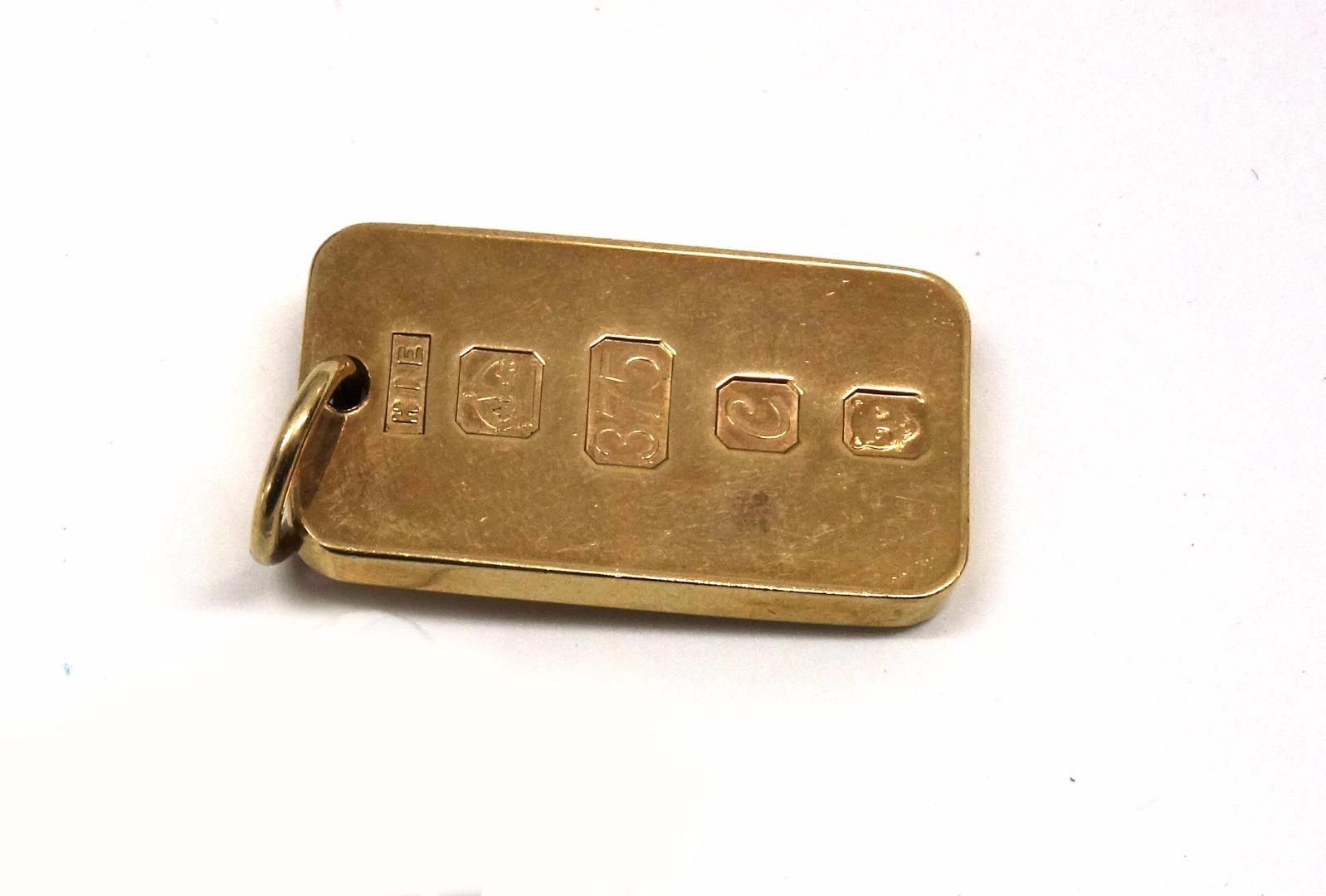 Appraisal: A ct gold Ingot pendant makers mark H E with