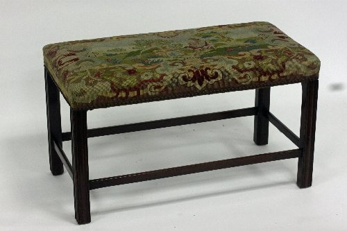 Appraisal: A mahogany rectangular stool the upholstered top on square chamfered