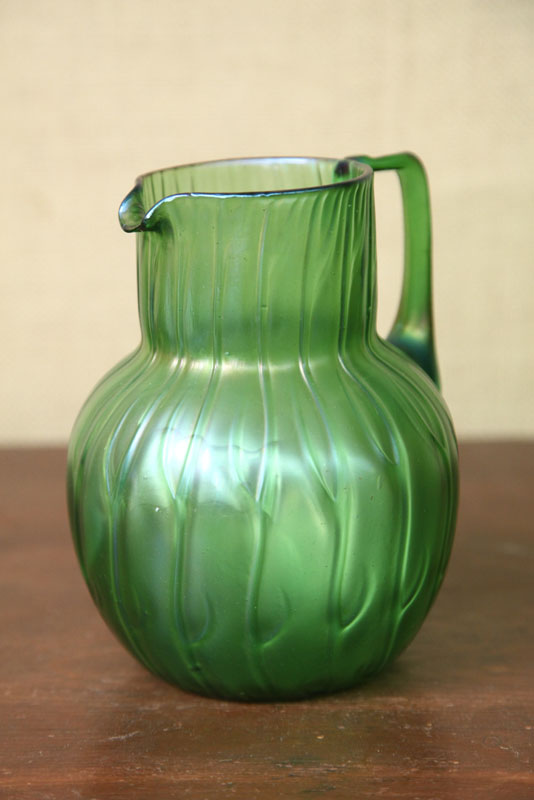 Appraisal: LOETZ PITCHER Ribbed green iridescent pitcher with appiled handle Signed