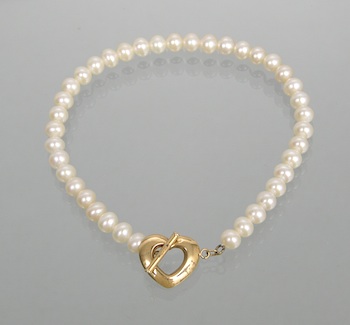 Appraisal: A Pearl Bracelet with a Heart Toggle Clasp A bracelet