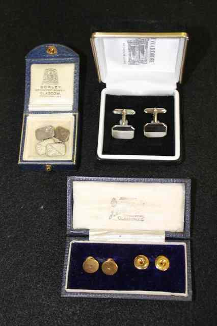 Appraisal: A CASED SET OF STUDS with mother of pearl decoration