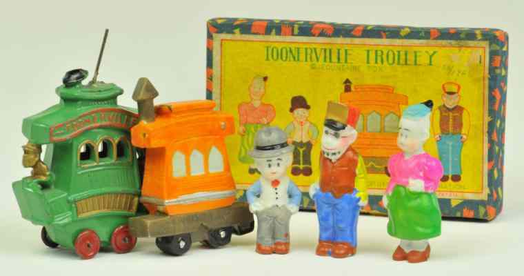 Appraisal: TOONERVILLE TROLLEY AND BOXED BISQUE FIGURE SET Slush-cast Toonerville Trolley