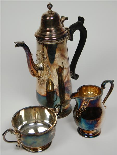 Appraisal: A three piece modern silver coffee set Sheffield comprising coffee