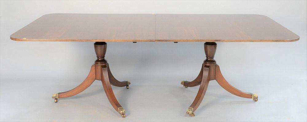 Appraisal: George III-style mahogany dining table double pedestal base ht leaves