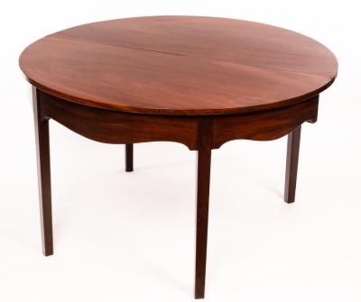 Appraisal: A George III mahogany D-shaped dining table the folding top