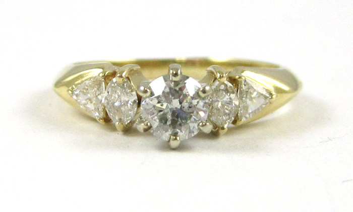 Appraisal: DIAMOND AND FOURTEEN KARAT GOLD RING with one oval-cut diamond