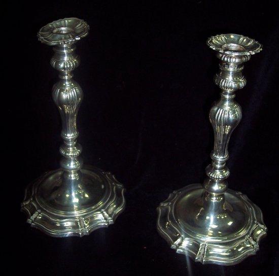 Appraisal: A pair of candlesticks of George II design with baluster