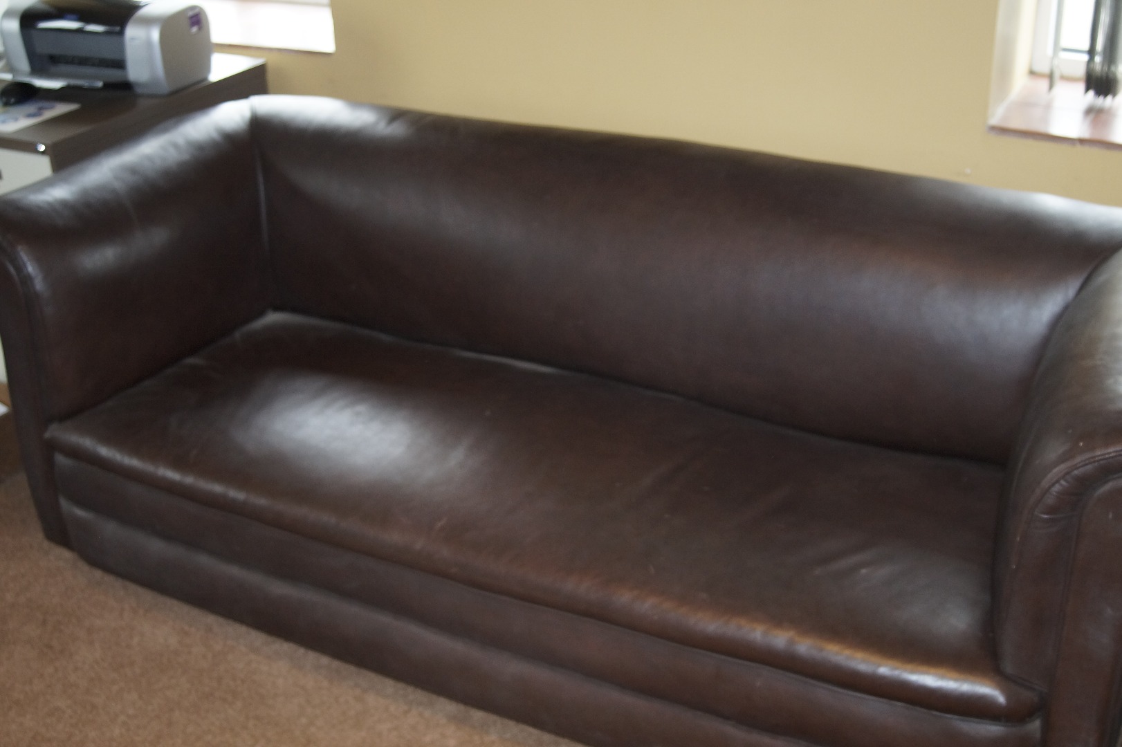 Appraisal: A brown leather chesterfield sofa cm wide