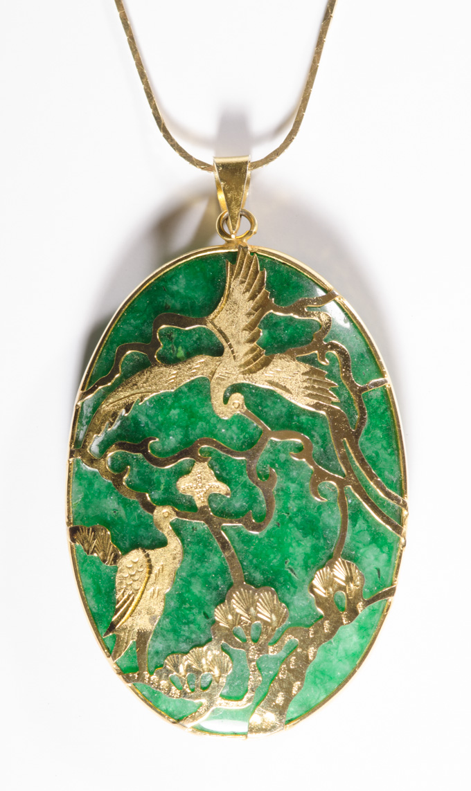 Appraisal: CHINESE GREEN JADE AND FOURTEEN KARAT GOLD PENDANT NECKLACE the