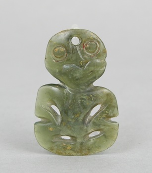 Appraisal: A Carved Hardstone Tiki Amulet from New Zealand A carved