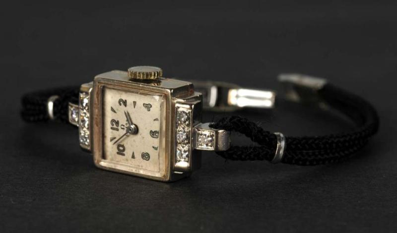 Appraisal: K Gold Ladies Omega Watch with Diamonds Description Rope band