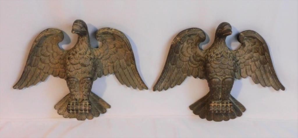 Appraisal: A PAIR OF CARVED POPLAR EAGLES TH C TWOornately carved