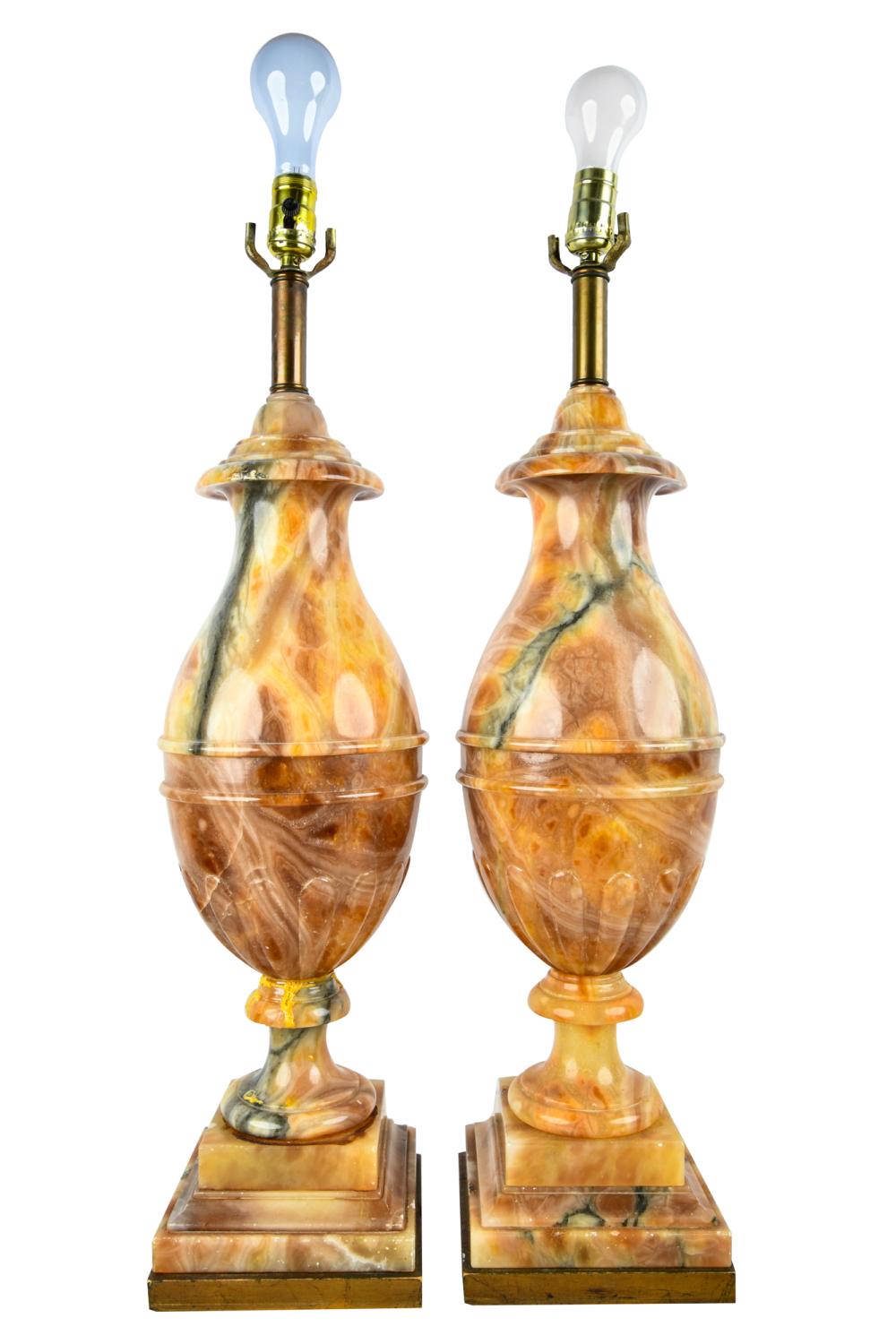 Appraisal: PAIR OF CARVED ONYX TABLE LAMPSCondition one having been re-glued