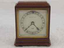 Appraisal: A mahogany cased day mantle clock by Elliott and retailed