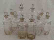 Appraisal: A mixed lot comprising ten apothecary jars with etched labels