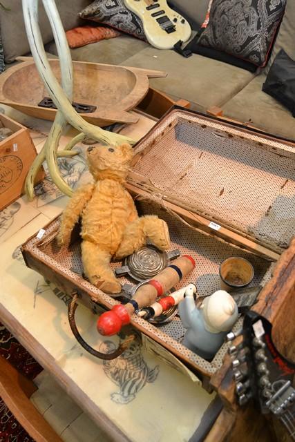 Appraisal: A VINTAGE LEATHER SUITCASE CONTAINING JELLY MOULDS TEDDY BEAR ETC