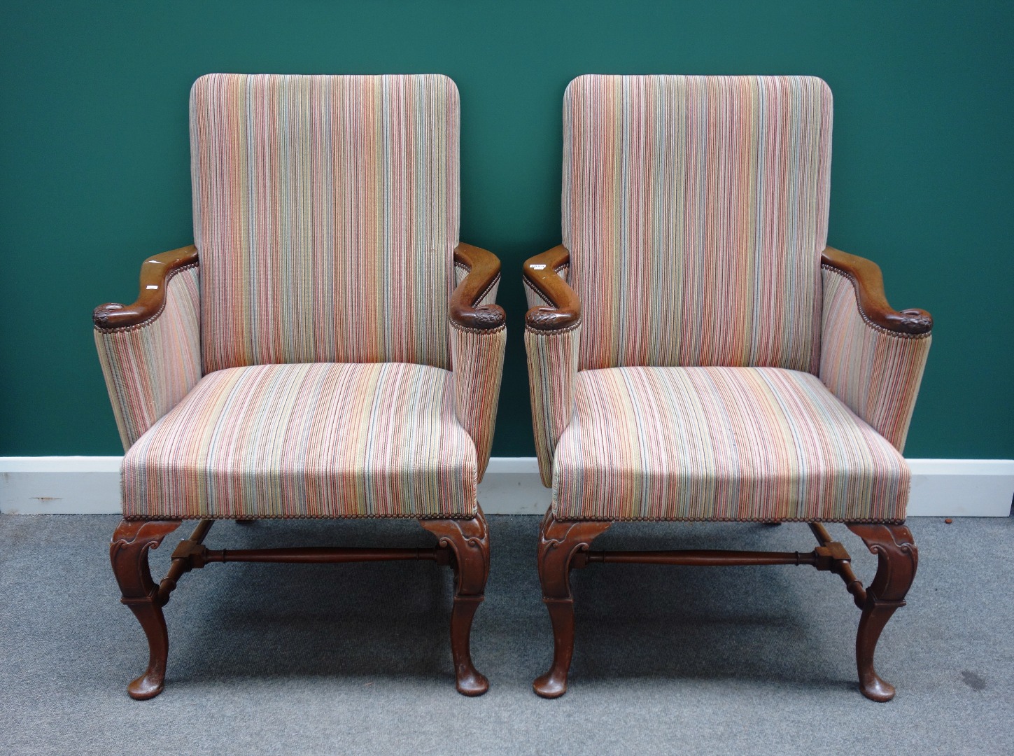 Appraisal: A pair of th century style mahogany framed armchairs upholstered