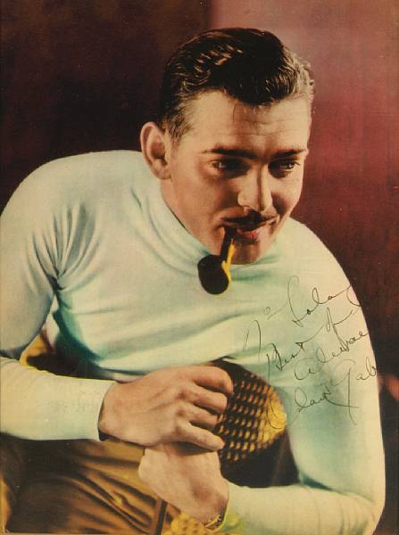 Appraisal: A Clark Gable signed color print s A magazine page