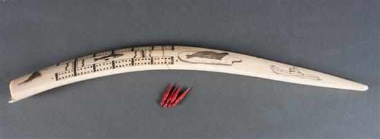 Appraisal: Walrus ivory scrimshaw cribbage board th century etched images include