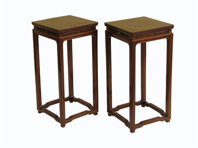 Appraisal: A pair of Chinese hardwood square tall stands with two