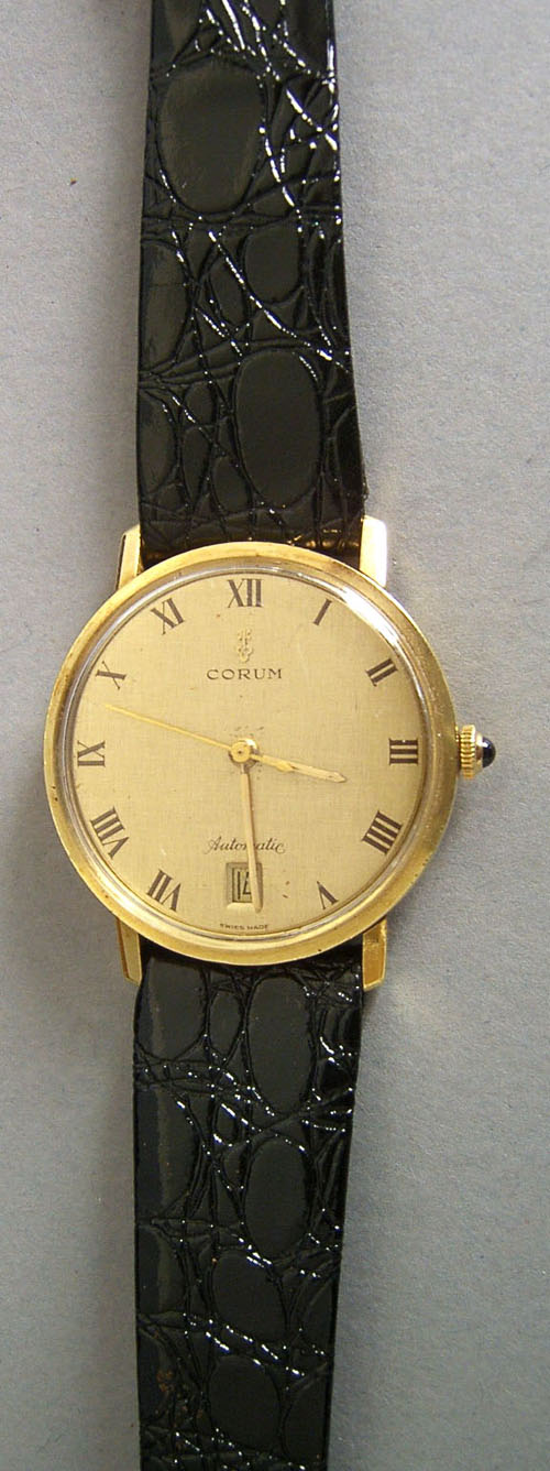 Appraisal: Corum K gold automatic wristwatch with sapphire cabochon the face