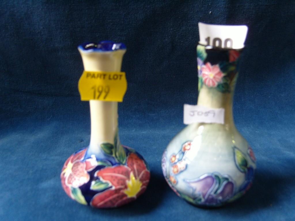 Appraisal: A pair of small Moorcroft type vases with drawn necks