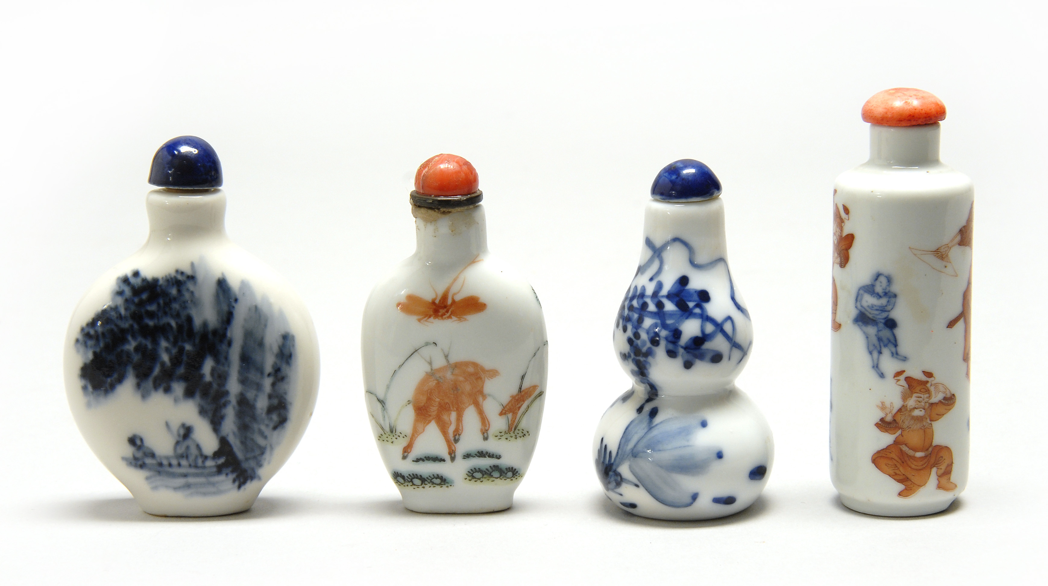 Appraisal: FOUR PORCELAIN SNUFF BOTTLES Includes two in flattened ovoid form