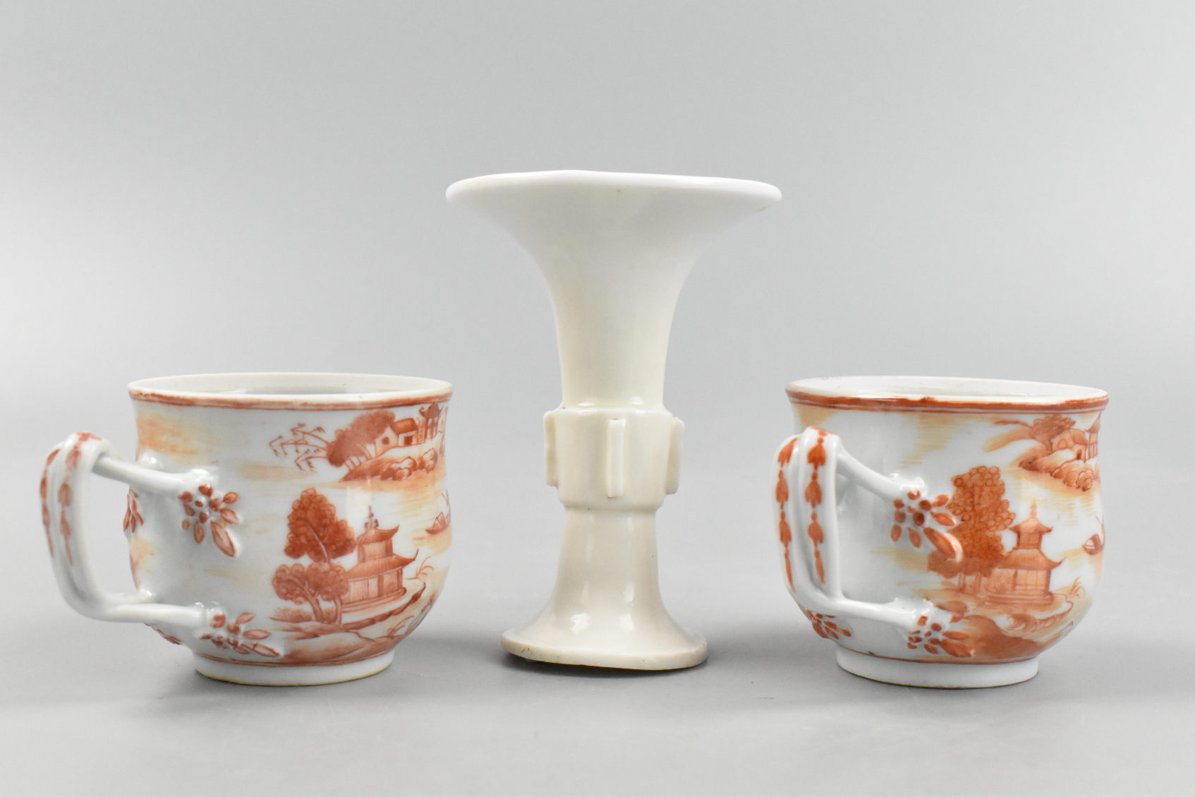 Appraisal: Two Chinese iron red cups with handles and a white