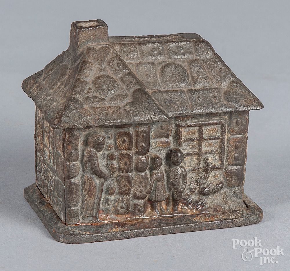 Appraisal: Cast iron gingerbread house still bank Cast iron gingerbread house