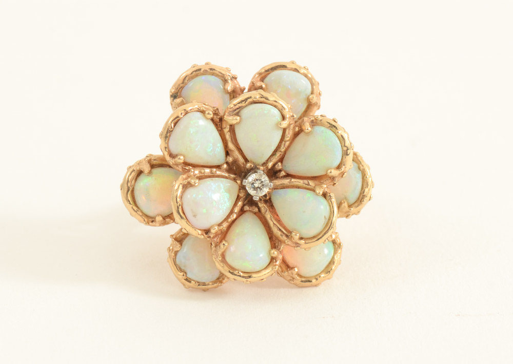 Appraisal: K GOLD AND OPAL RING pear-shaped natural white opals form