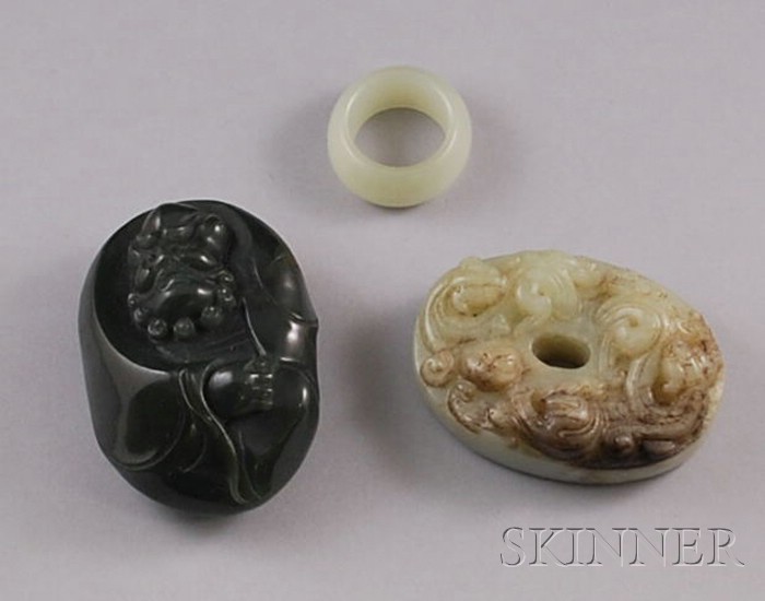 Appraisal: Three Asian Carved Jade Items a relief figure of an