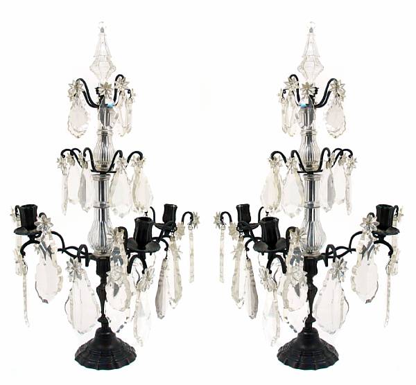 Appraisal: A pair of patinated brass and crystal three light girandoles