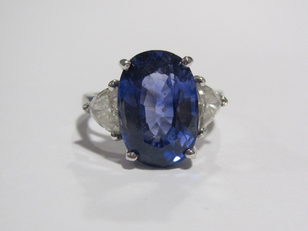 Appraisal: A platinum tanzanite and diamond three stone ring with oval