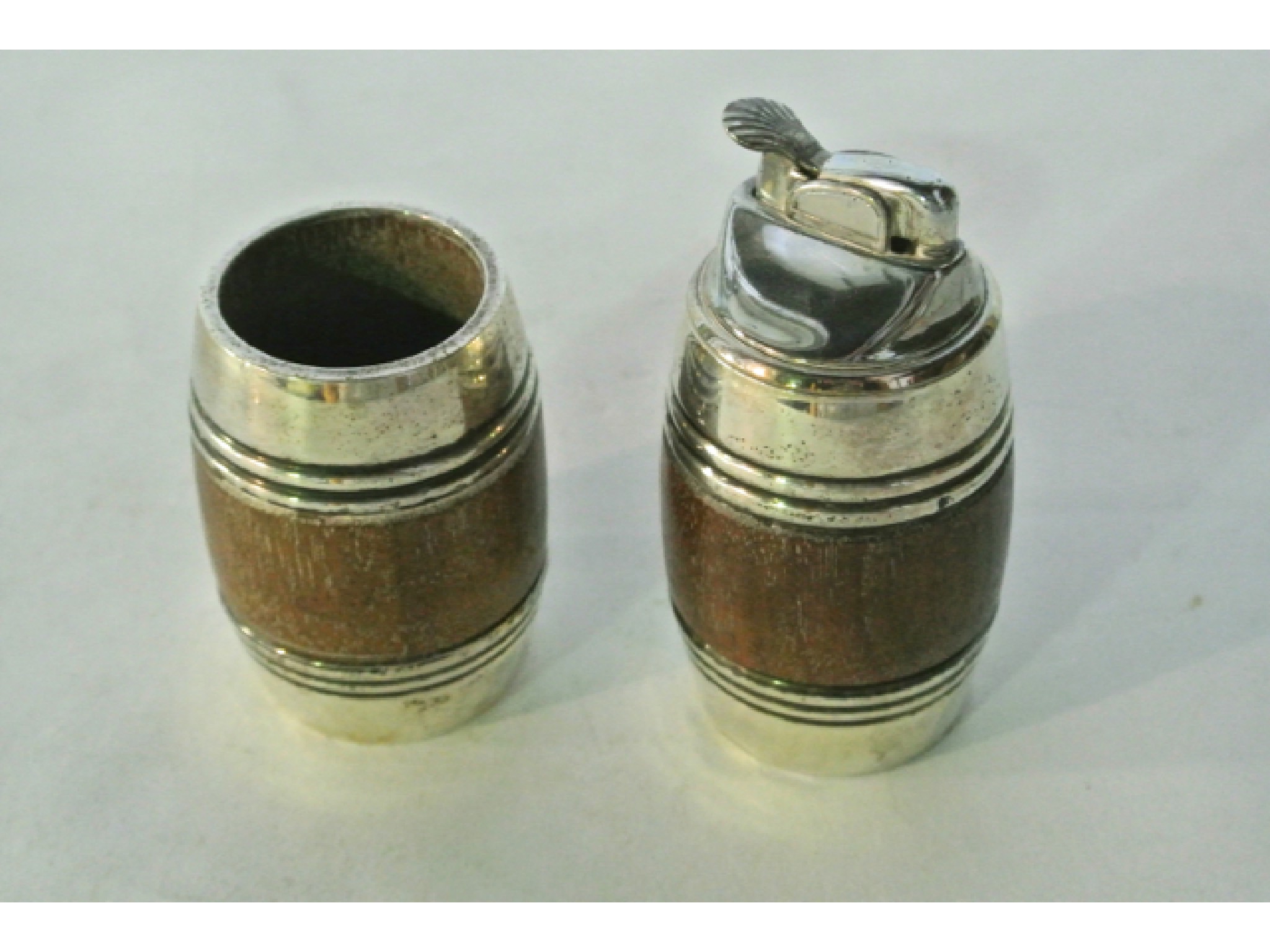 Appraisal: A Sterling silver-mounted cigarette cup and lighter Cartier each of