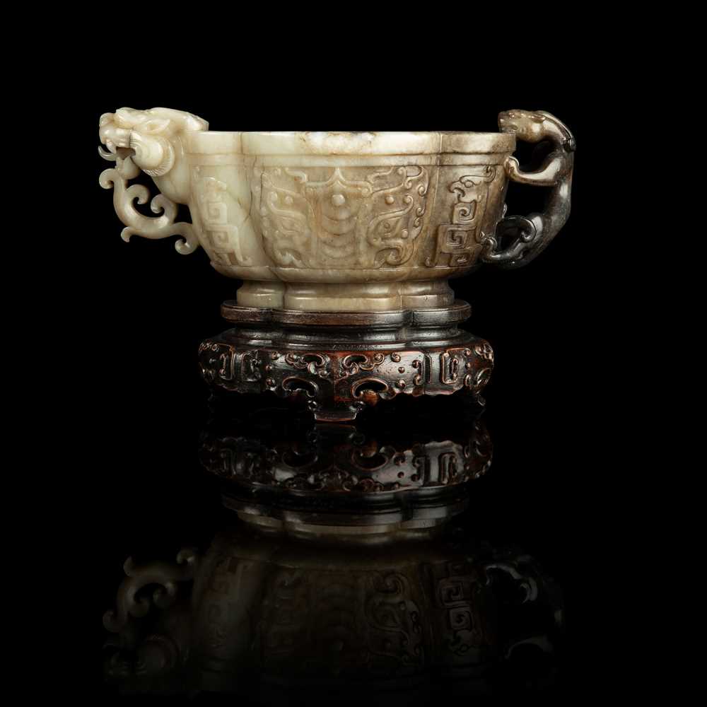 Appraisal: WHITE AND RUSSET JADE 'TAOTIE' CUP WITH DRAGON AND CHILONG