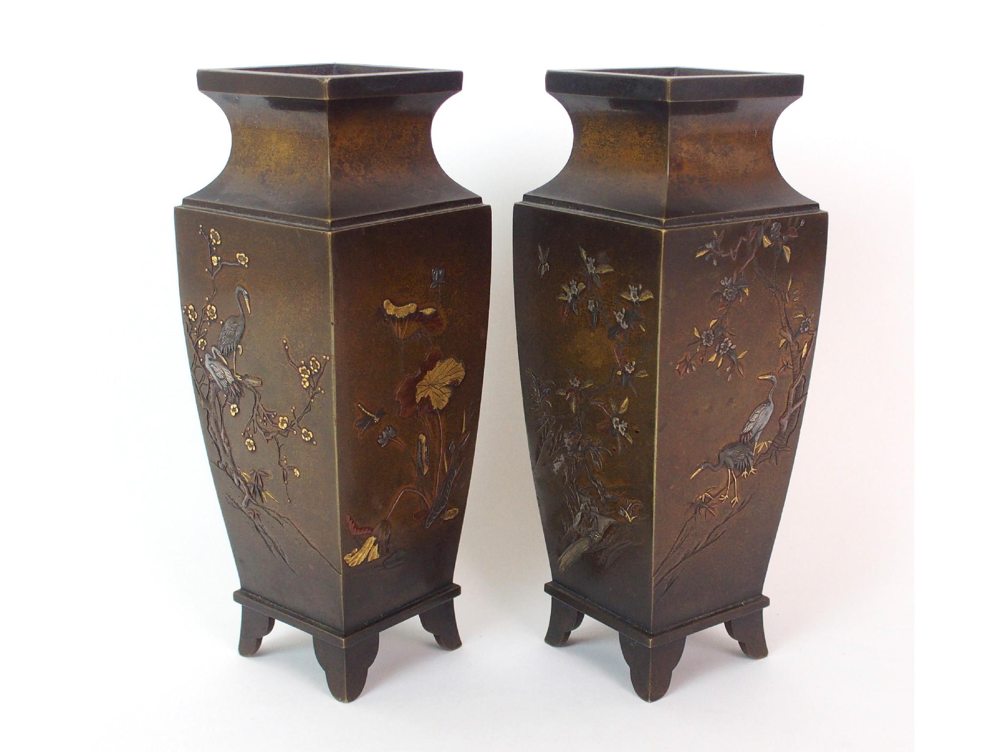 Appraisal: A pair of Japanese bronze square shaped vasesdecorated in gold