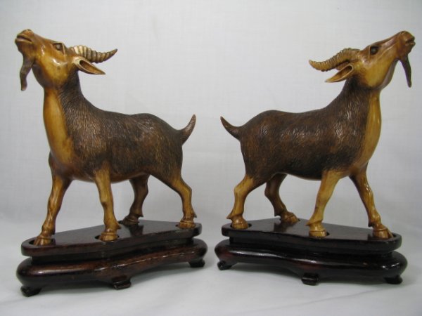 Appraisal: Pair of Chinese molded and carved faux horn mountain goats